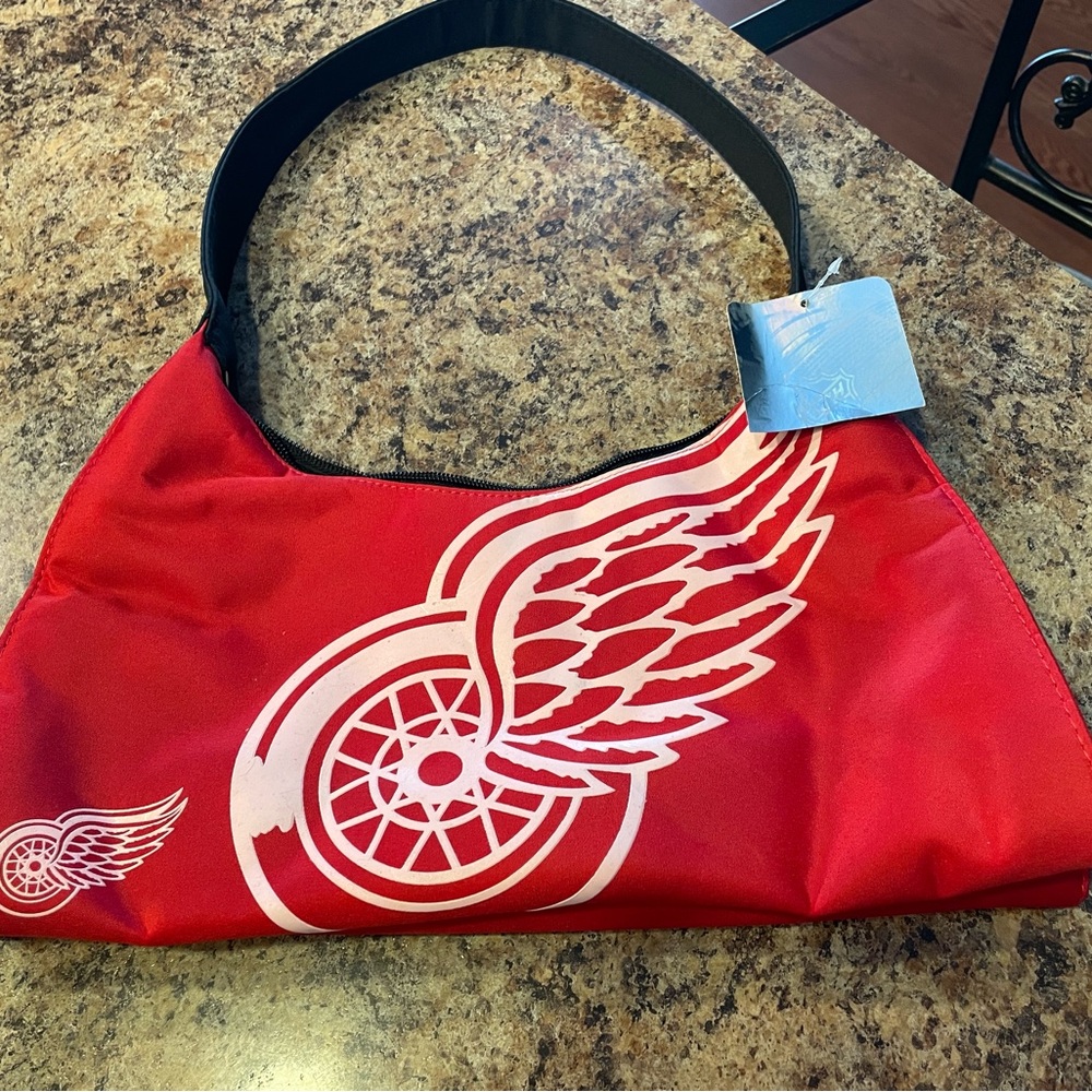 Red wings shoulder bag